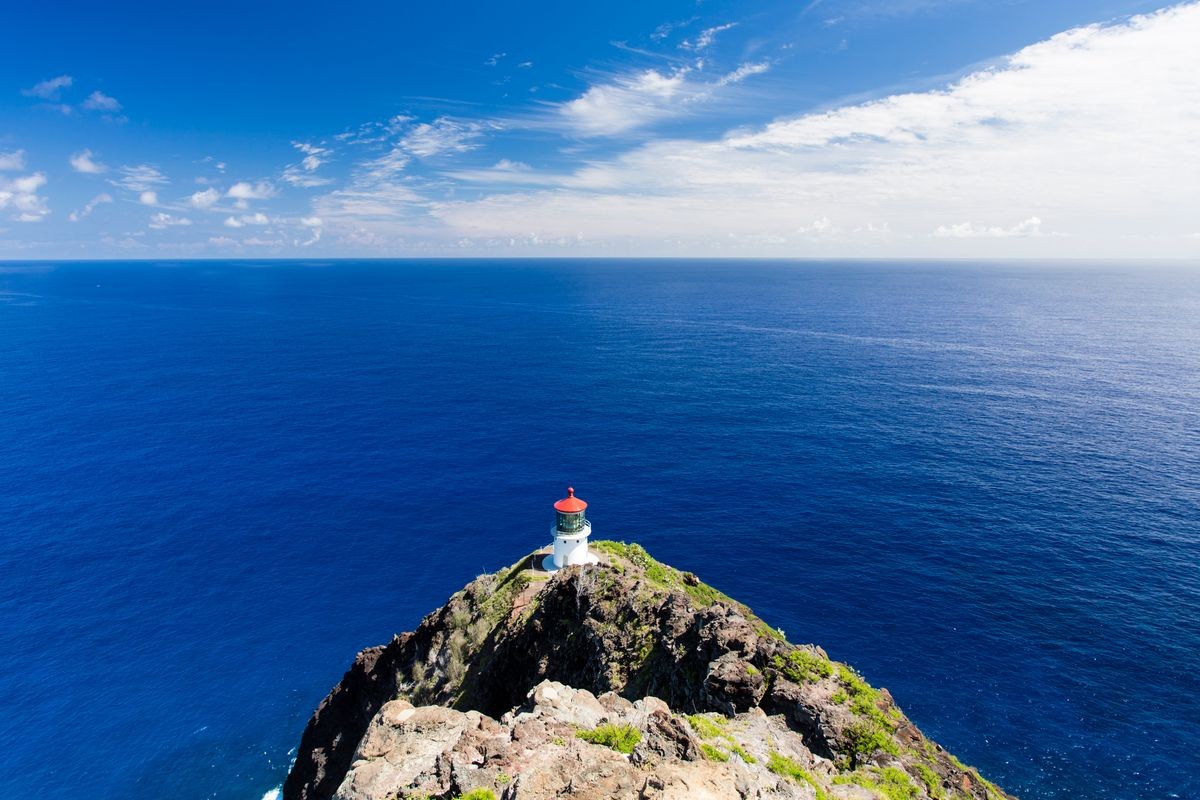 Makapu'u Lighthouse over steep cliffs of Southeastern O'ahu, Hawaii, overlooking Pacific Ocean